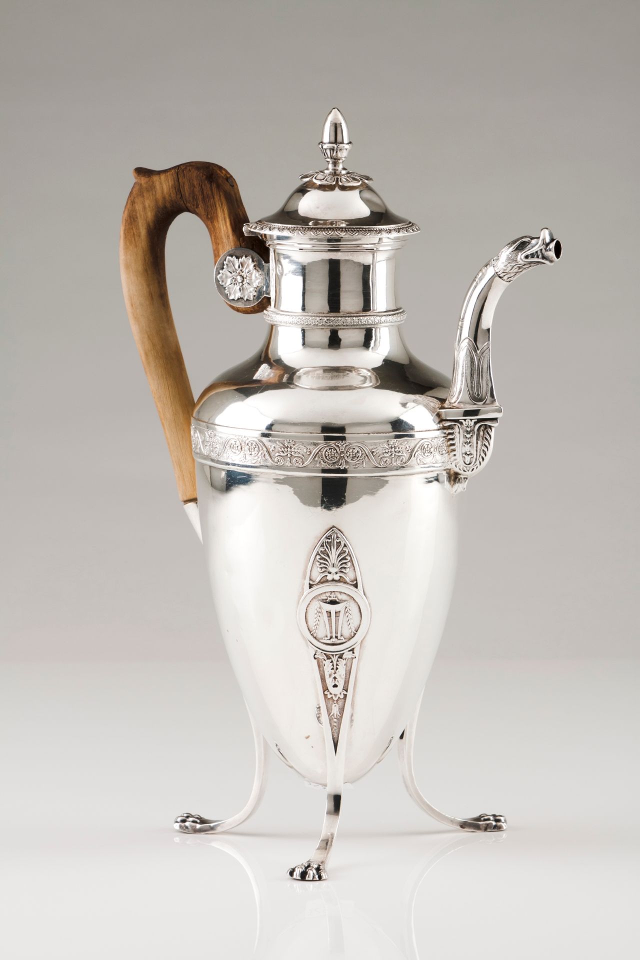 A coffee pot with coverFrench silver Empire style, plain urn shaped body of engraved foliage ban