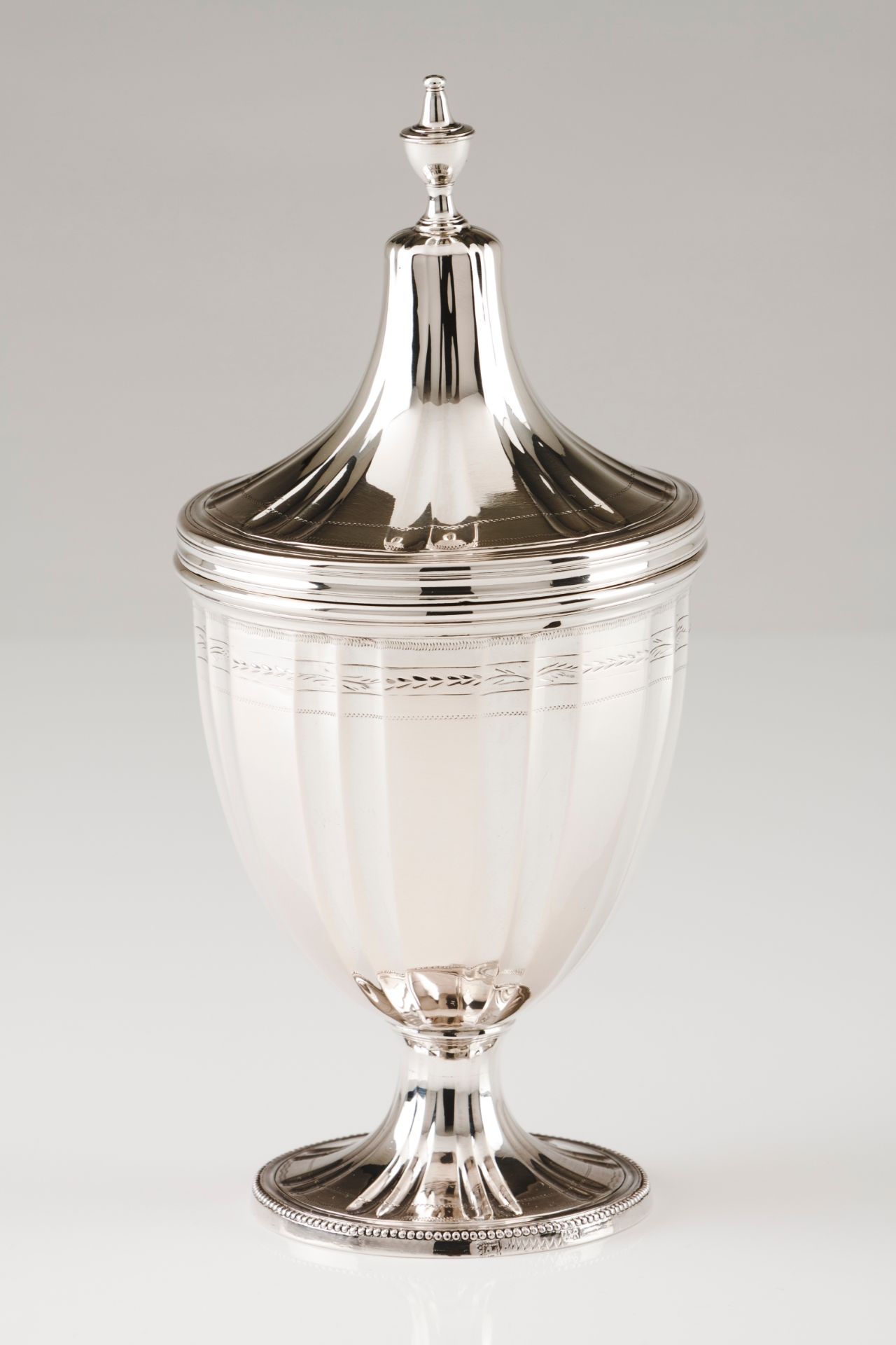 A sugar bowl with coverPortuguese silver, early 19th century Urn shaped body of fluted and facet