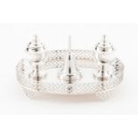 An inkwellPortuguese silver Oval stand with pierced gallery on 4 geometric motifs pierced feet