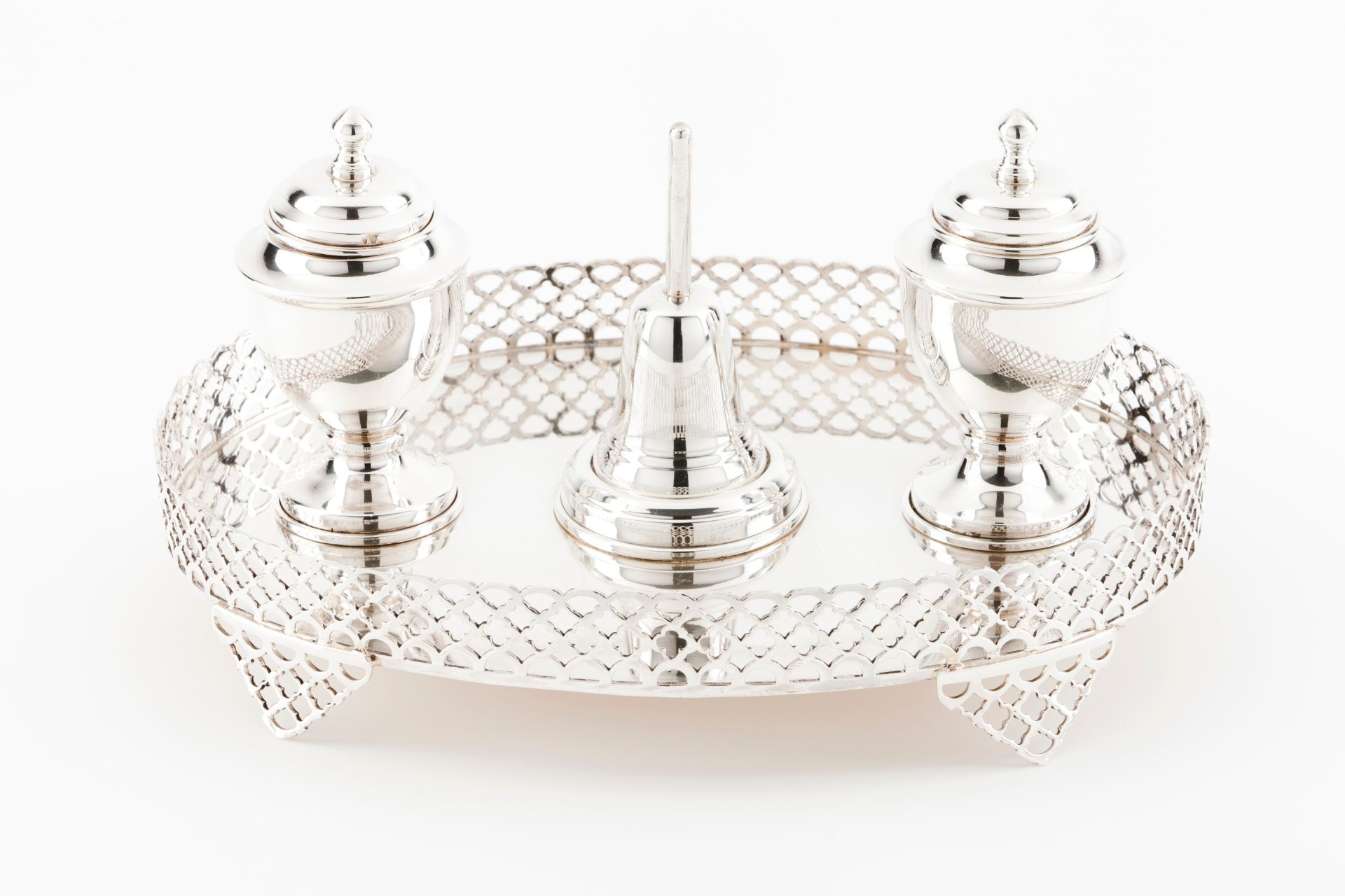 An inkwellPortuguese silver Oval stand with pierced gallery on 4 geometric motifs pierced feet