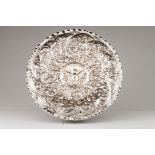 A display salverSilver, 1st half 18th century Profuse raised decoration with birds, vegetation a