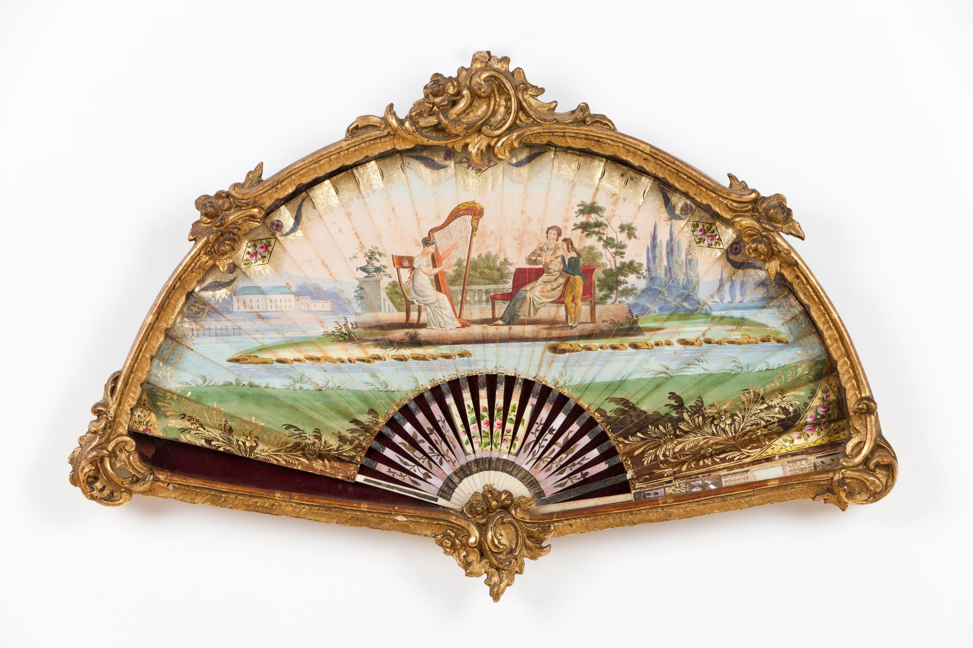 A framed handheld fan