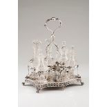 A large cruet setPortuguese silver, 19th century Chiselled, pierced and foliage engraved decorat