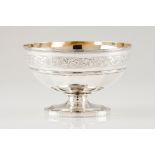A footed bowlEnglish silver Part faceted body of engraved floral and foliage band on a scalloped