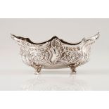 A small bowlPortuguese silver Boat shaped of geometric, floral and foliage repousse motifs on 4