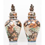 A pair of vases with covers