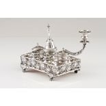 An inkwellPortuguese silver, 19th century Rectangular stand of pierced gallery with vines and gr