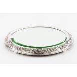 A centrepieceSilver framed mirrored stand Low relief wine related decoration on 4 flattened ball