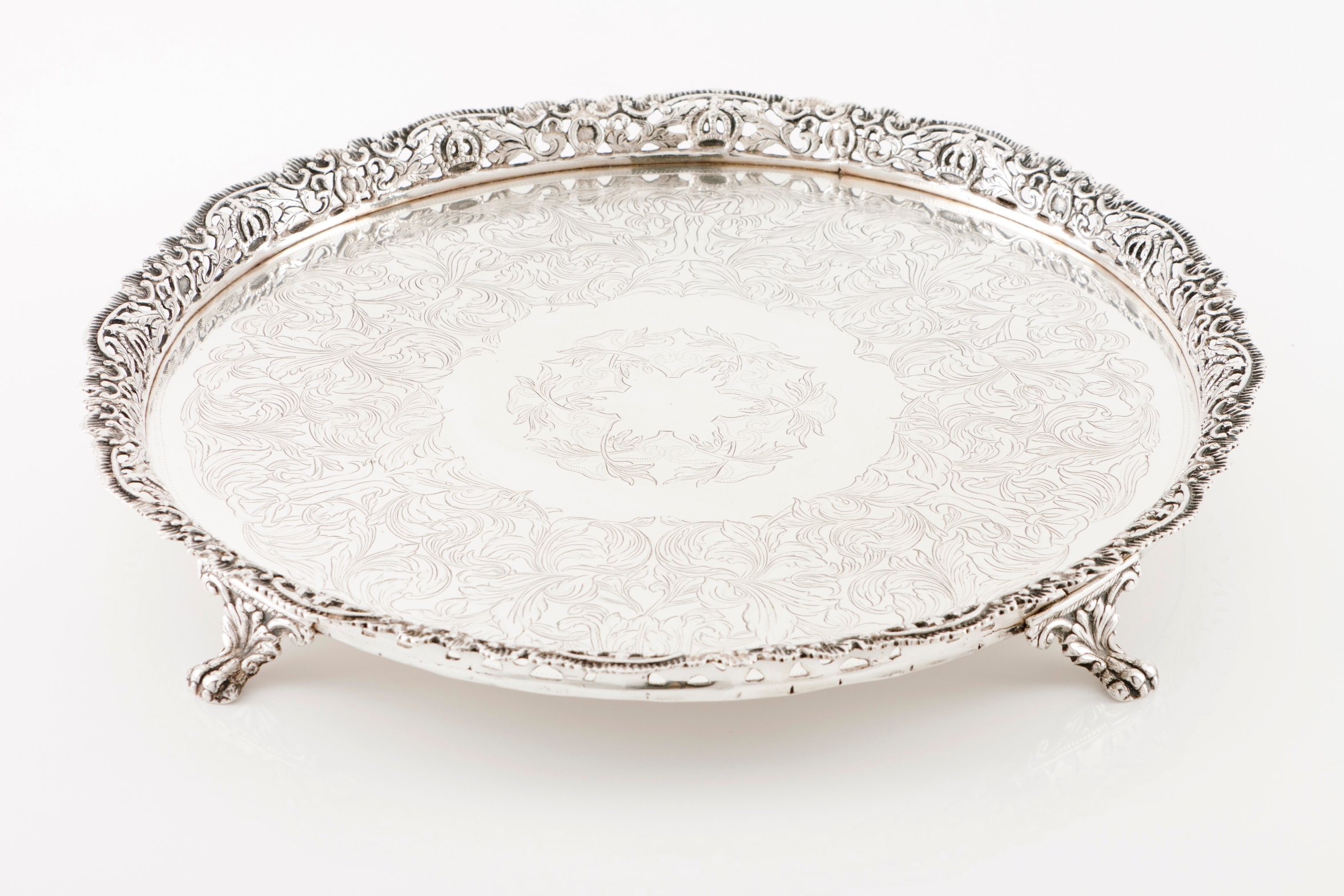 A galleried salverPortuguese silver 19th century Profuse decoration to centre with double band o