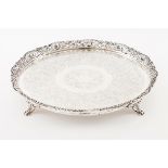 A galleried salverPortuguese silver 19th century Profuse decoration to centre with double band o