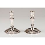 A pair of candlestandsAustrian silver Turned and faceted shaft on a stepped octagonal raised sta