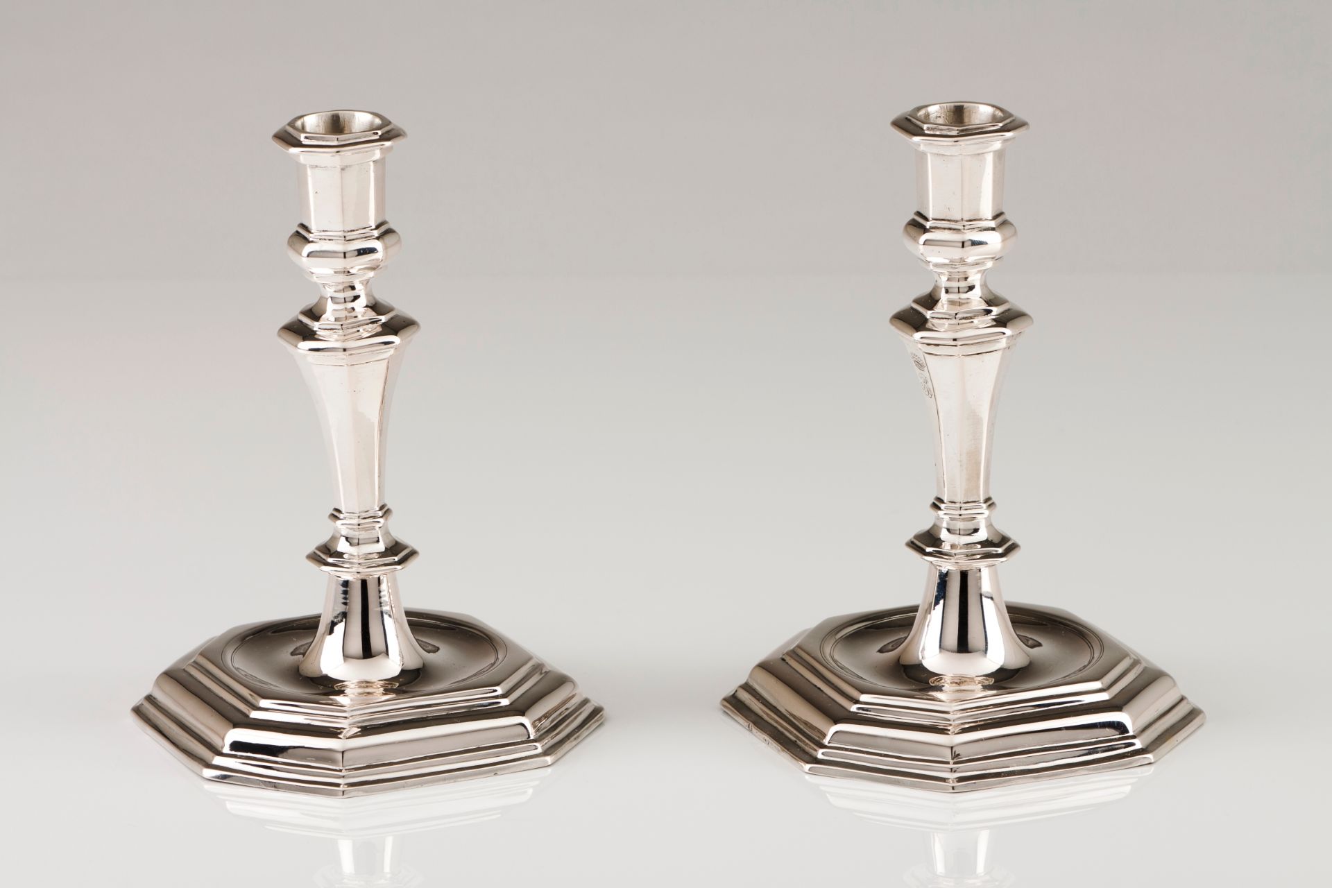 A pair of candlestandsAustrian silver Turned and faceted shaft on a stepped octagonal raised sta