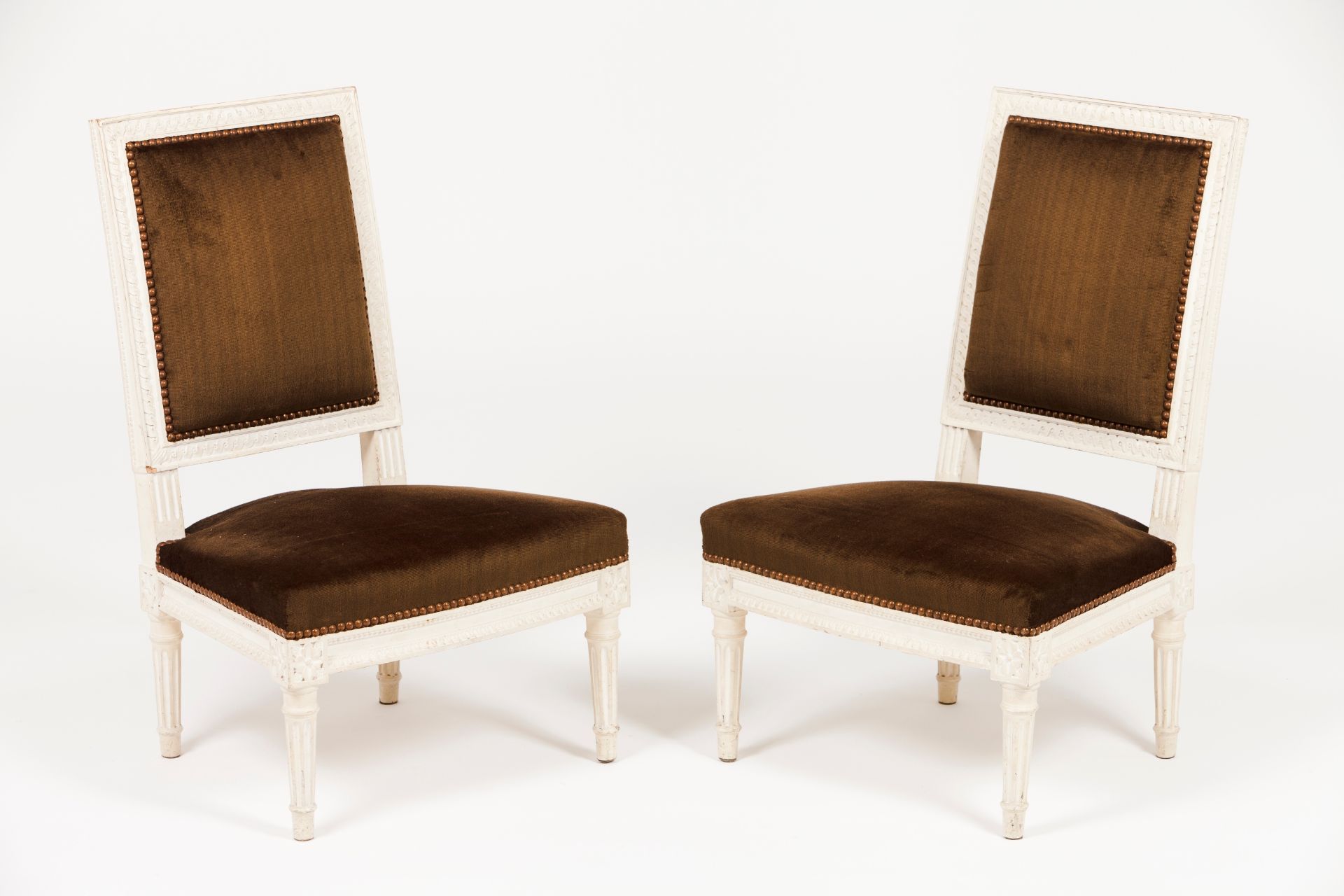 A pair of Louis XVI style low chairs