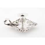 A chamber stickPortuguese silver Squared stand, of raised three trunk, floral and foliage decora