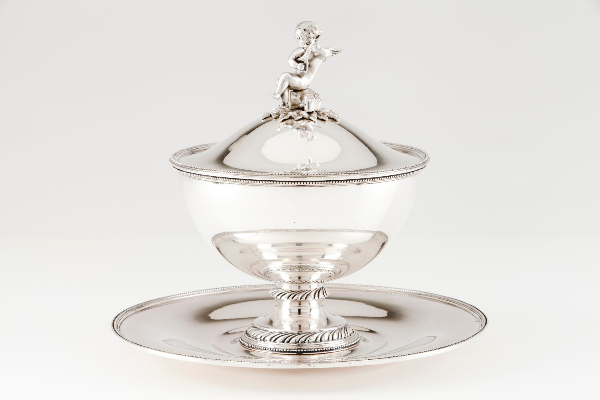 A tureen with cover and trayPortuguese silver Plain circular body on a foot of spiralled volutes