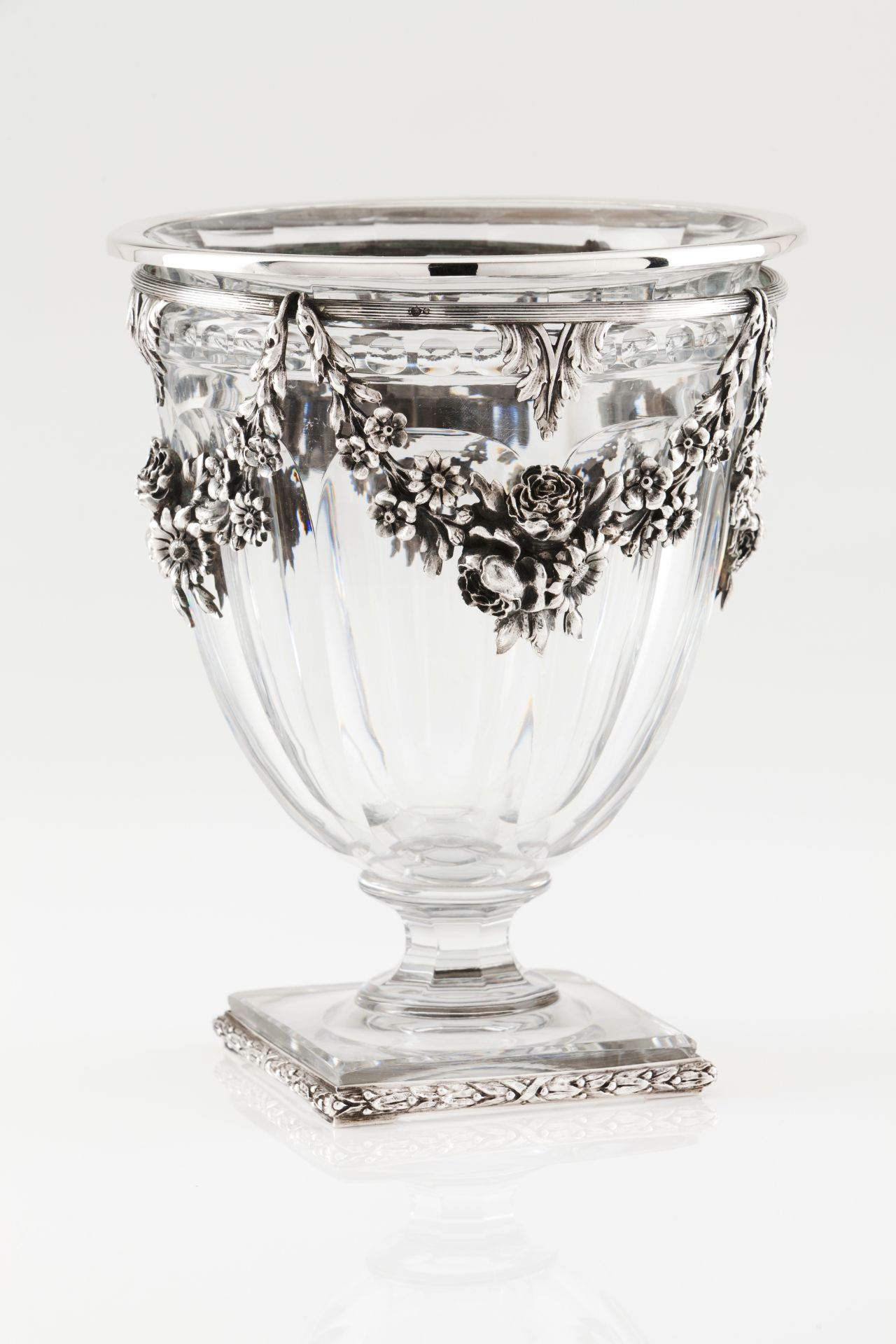 A VaseCut crystal with applied silver elements Floral and foliage decoration of garlands and aca