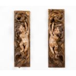 A pair of carved fragments with cherubs