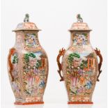 An unusual pair of vases and covers