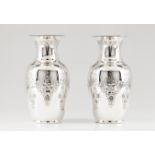 A pair of vasesPortuguese silver Engraved and chiselled body and neck decoration of foliage, bo