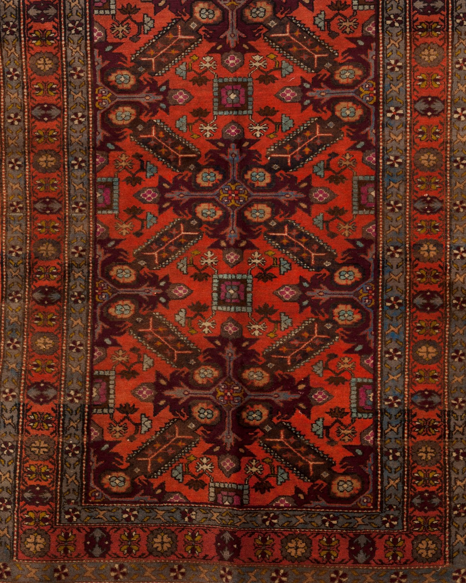 A Russian rug, CaucasusWool of geometric and floral pattern in salmon, beige and blue shades
