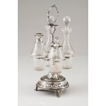 A cruet setPortuguese silver Raised circular stand of volute and spiralled grooves Two glass cru