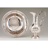 An Art Nouveau ewer and basinPortuguese silver Raised foliage, winglets, volutes and scroll deco