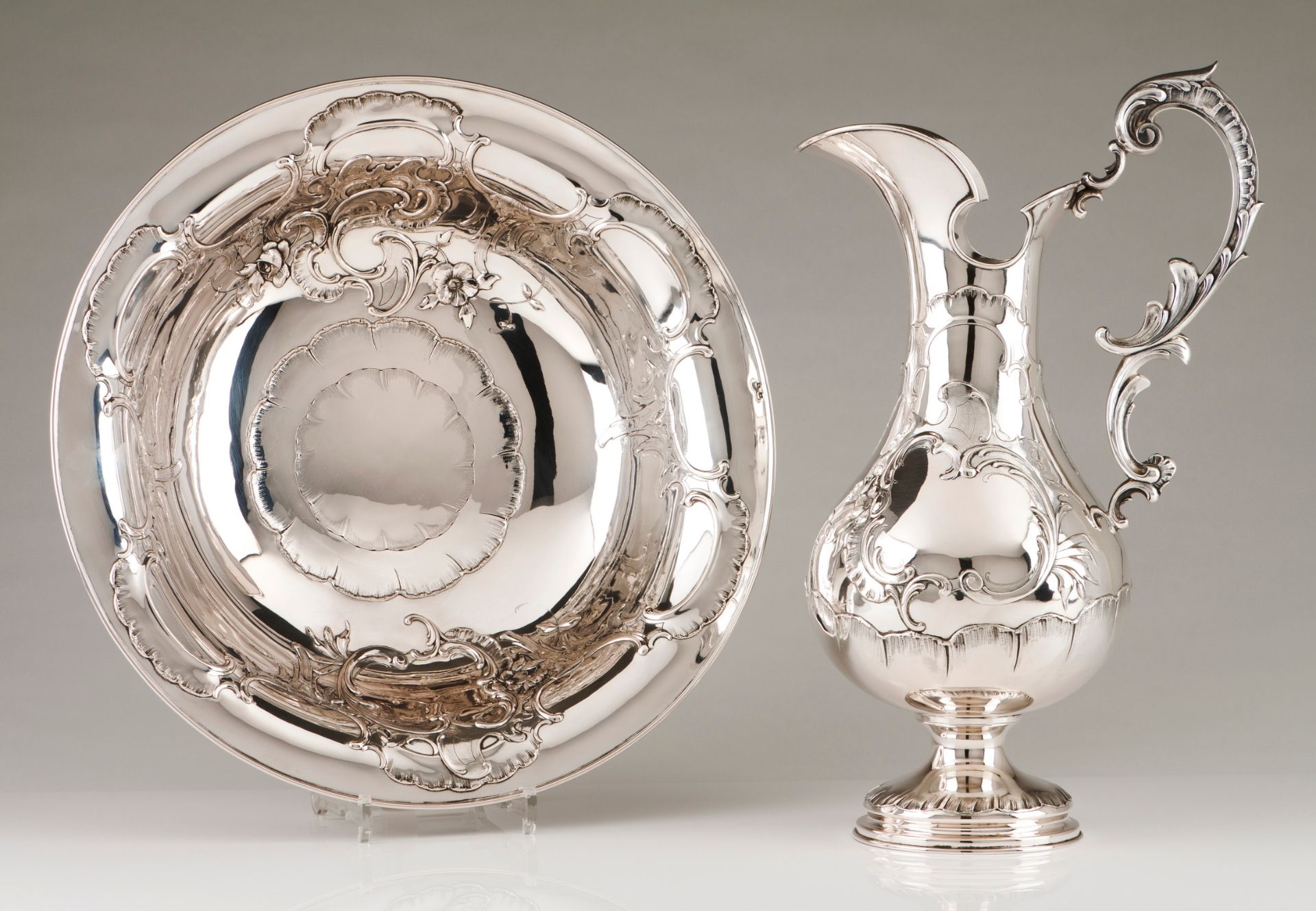 An Art Nouveau ewer and basinPortuguese silver Raised foliage, winglets, volutes and scroll deco