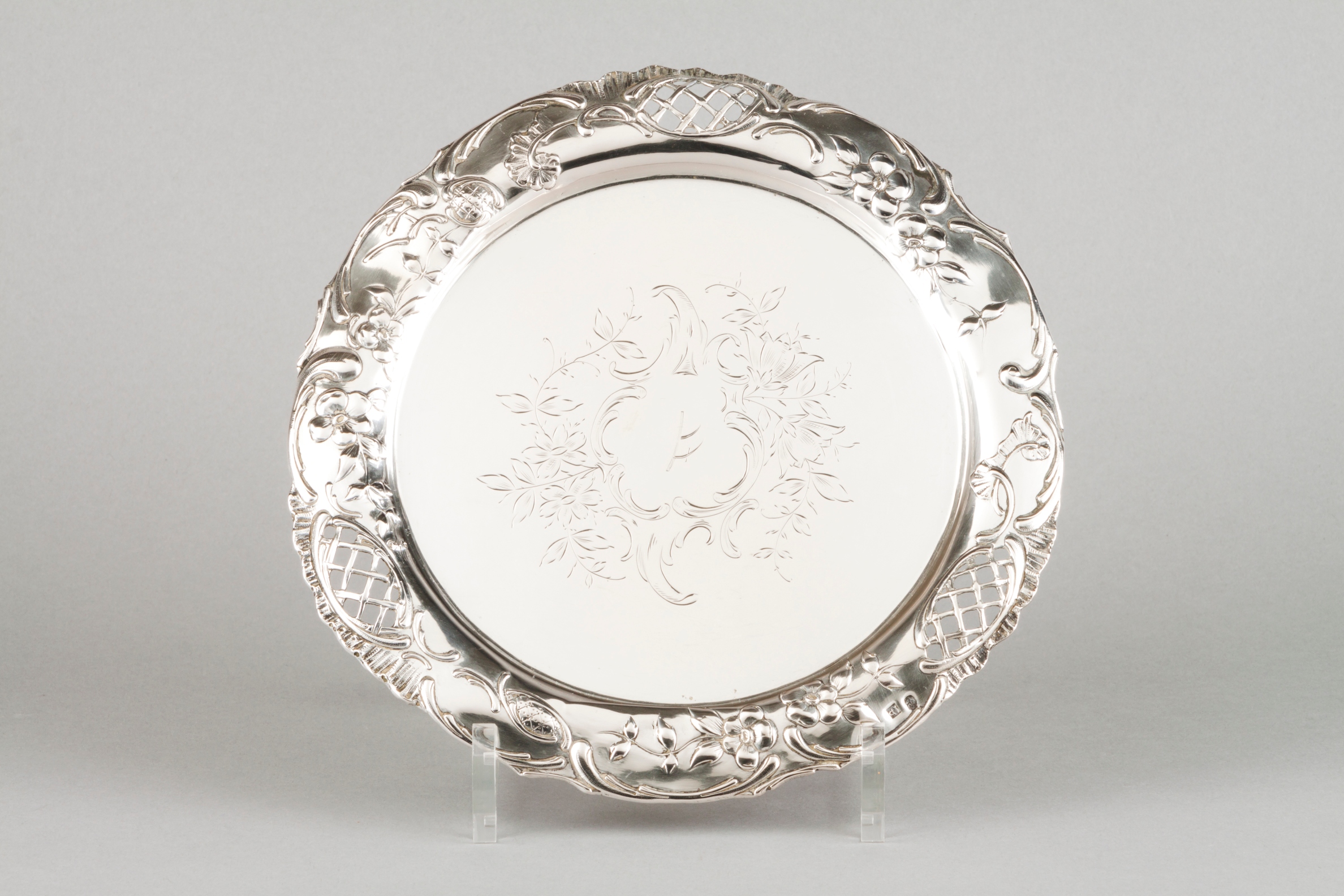 A salverPortuguese silver Central chiselled floral decoration with part pierced lip of raised fl