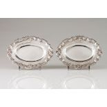 A pair of small traysPortuguese silver Elliptic shaped of plain centre and engraved lip of foli