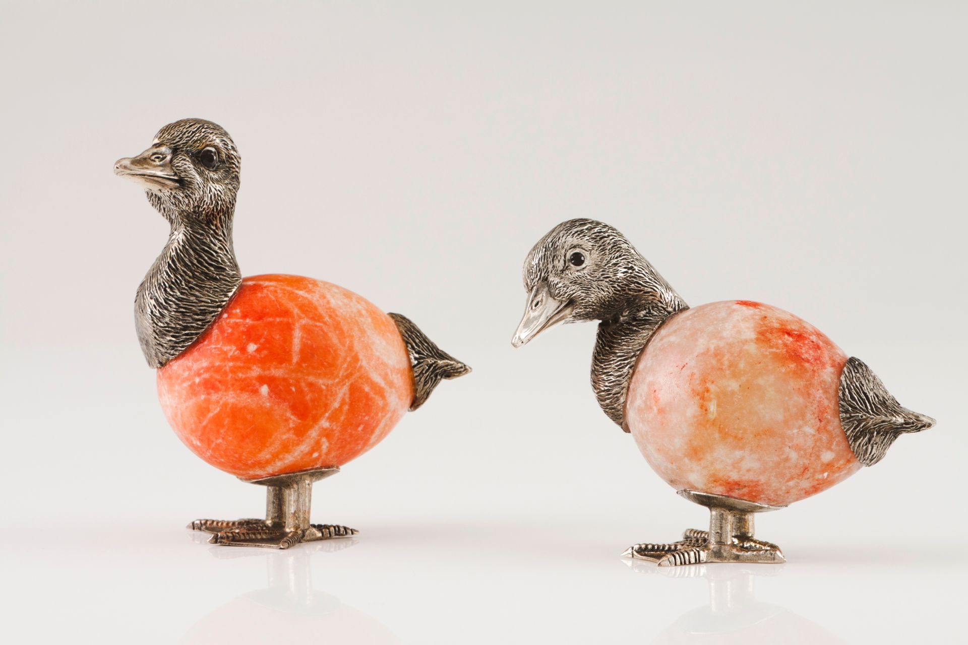 A pair of ducksSilver and hard stone Moulded and engraved sculpture with applied glass eyes Rabb