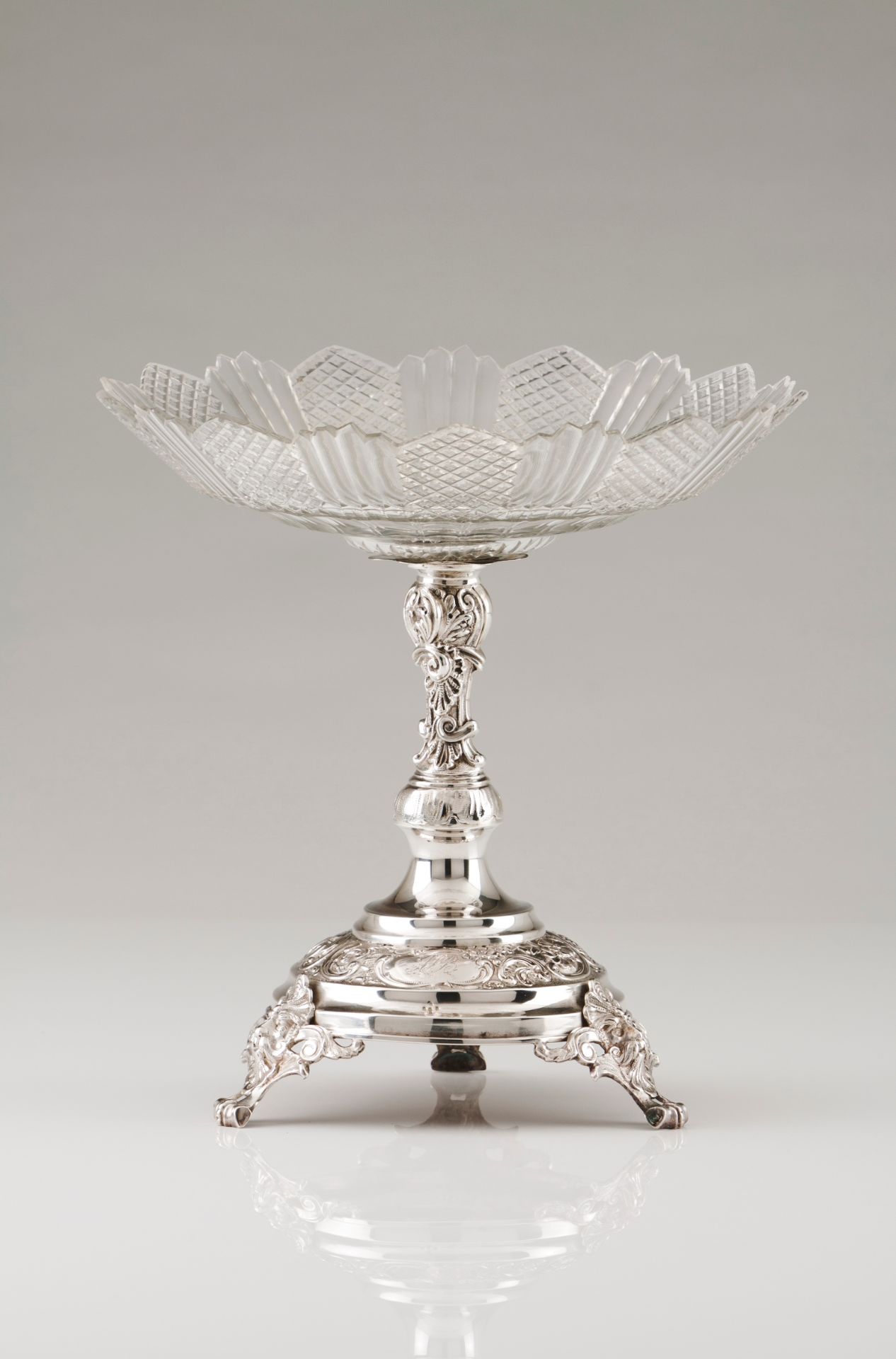 A plateau/fruit bowlPortuguese silver Cut glass bowl on a high-relief foliage decoration turned