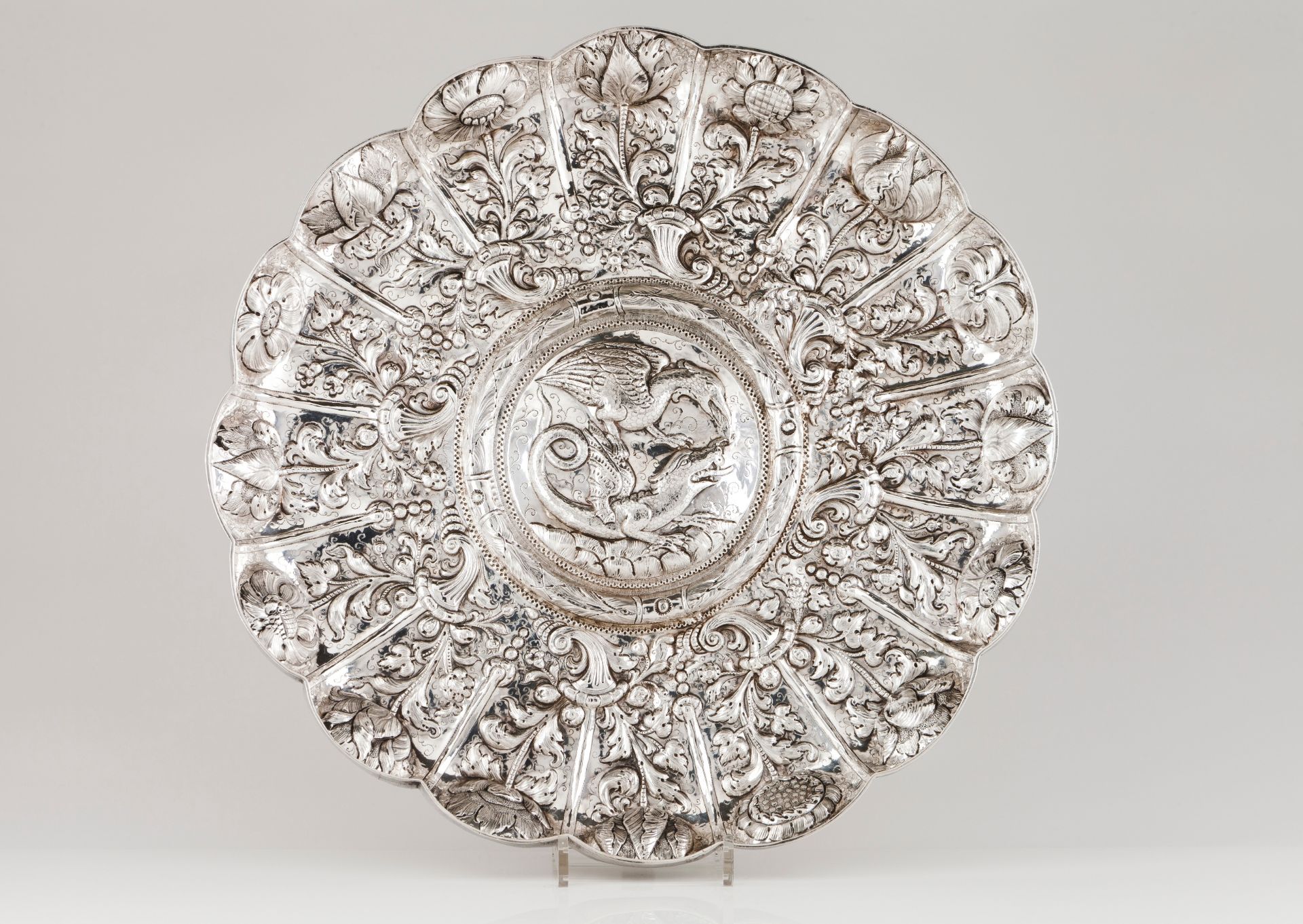 A large display salverSilver, 18th century Gadrooned of profuse repousse and chiselled foliage,