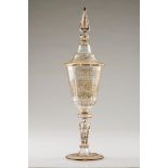 A large footed glass with coverBohemian crystal Gilt decoration of scrolls, foliage motifs and C