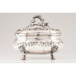 A large tureen and coverPortuguese silver Oval shaped body, hammered and part fluted, on 4 sleep