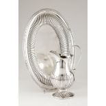 A ewer and basinPortuguese silver, 19th century Part fluted body, scalloped spout and scrolled v