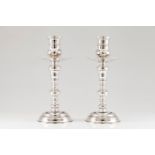 A pair of large candle standsPortuguese silver Turned and hammered decoration to base, shaft and