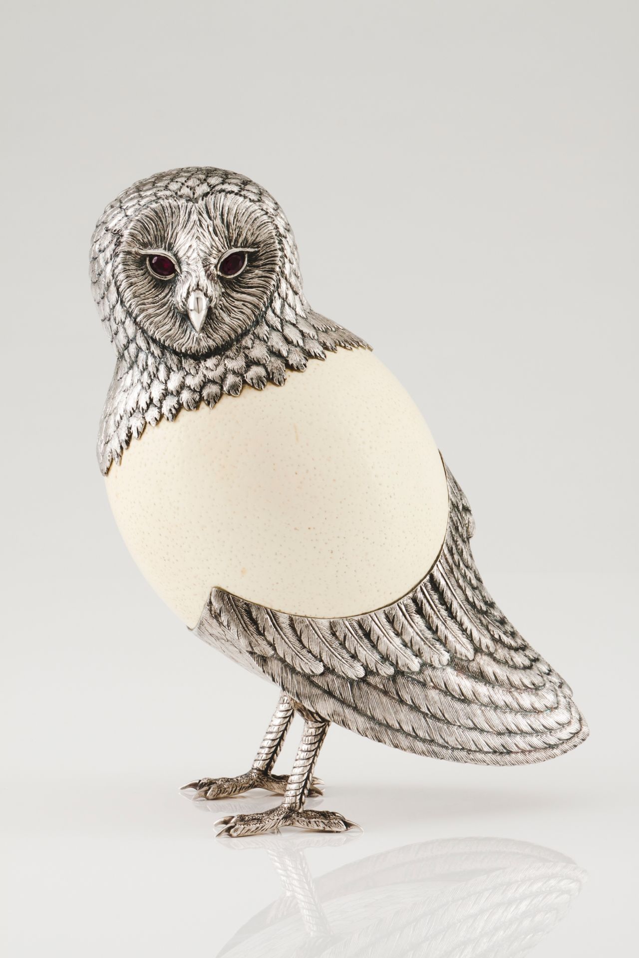 An owlSilver and ostrich egg Moulded decoration of engraved and chiselled feathers with applied