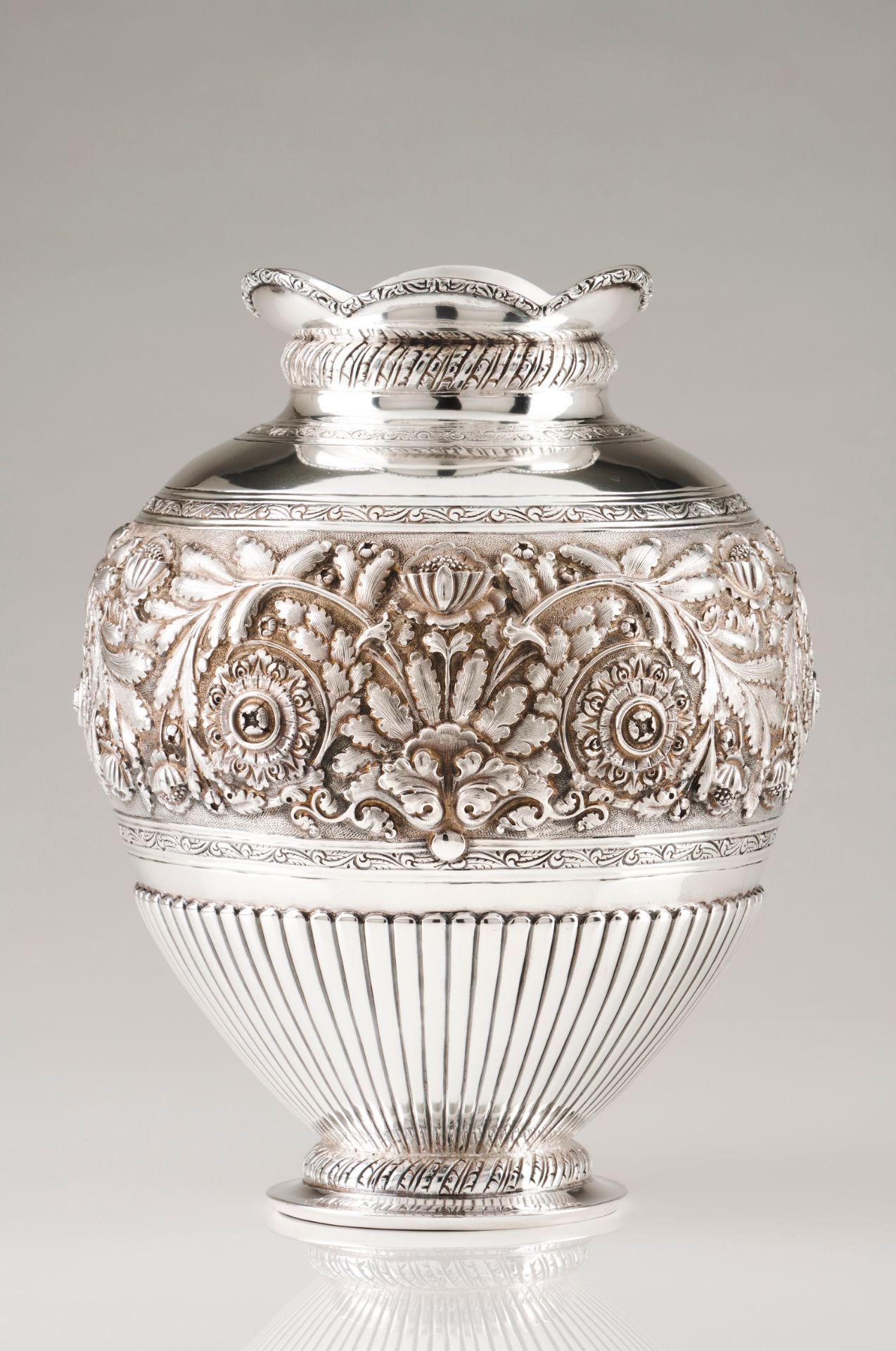 A large vasePortuguese silver Part fluted body of raised, engraved and chiselled foliage motifs