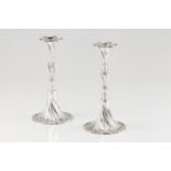 A pair of spiralled candle standsPortuguese silver Spiralled fluted shaft and foot with engraved