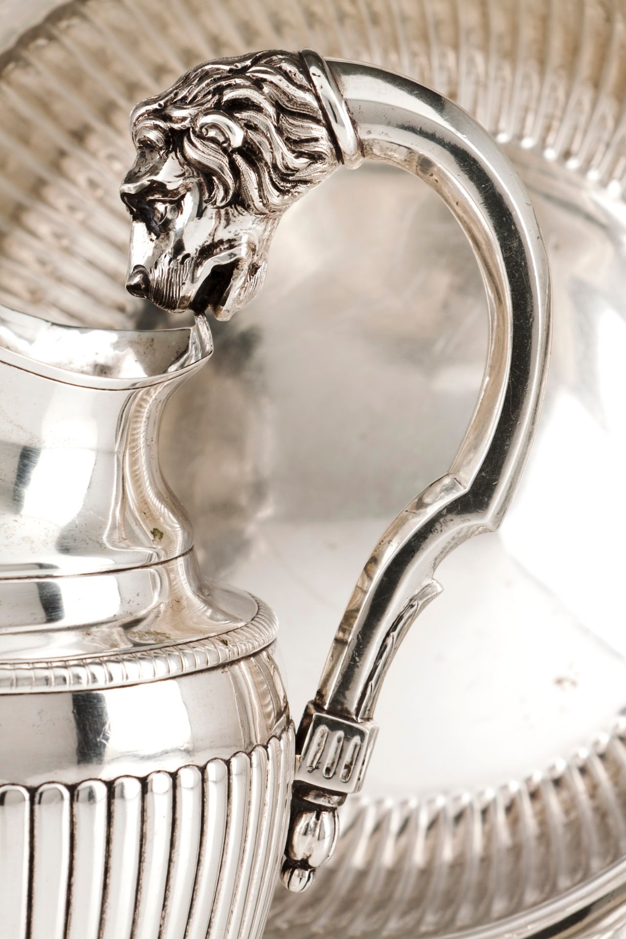 A ewer and basinPortuguese silver, 19th century Part fluted body of gadrooned lip Faceted handle - Image 2 of 2