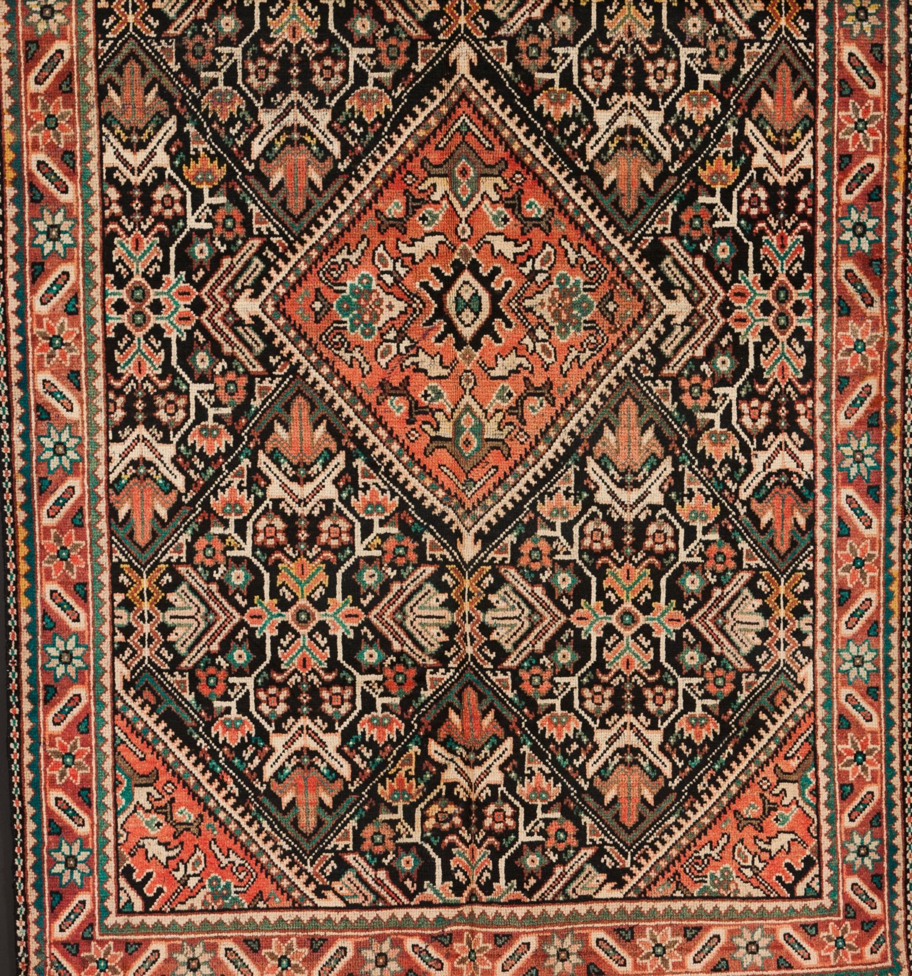 A Zarand rug, IranWool and cotton of geometric and floral pattern in salmon, blue and beige shad