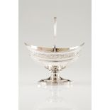A sweetmeats dish with handleEnglish silver, 18th century Boat shaped of part faceted and engrav