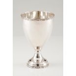 A bowlPortuguese silver Large chalice shaped plain body of engraved foliage bands to top and foo