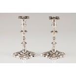 A pair of D.João V candlestandsPortuguese silver Turned faceted shaft on a raised scalloped stan