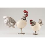 A cockerel and henMoulded, scalloped, engraved and chiselled sculpture with dyed shell combs and