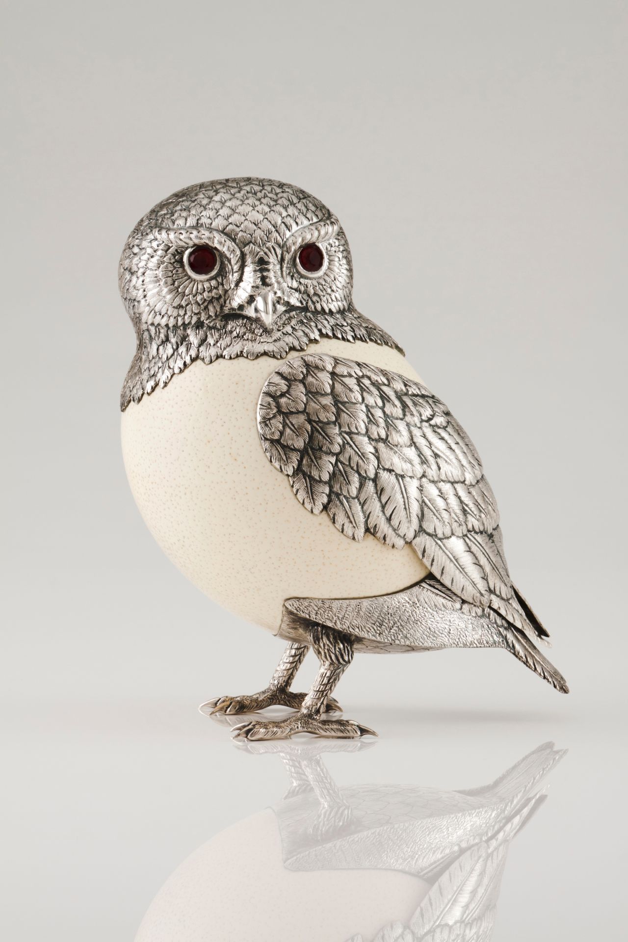 An owlSilver and ostrich egg Moulded decoration of engraved and chiselled feathers with applied