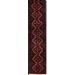 A Baluchi rug, IranWool and cotton of geometric and floral pattern in beige, bordeaux and blue s