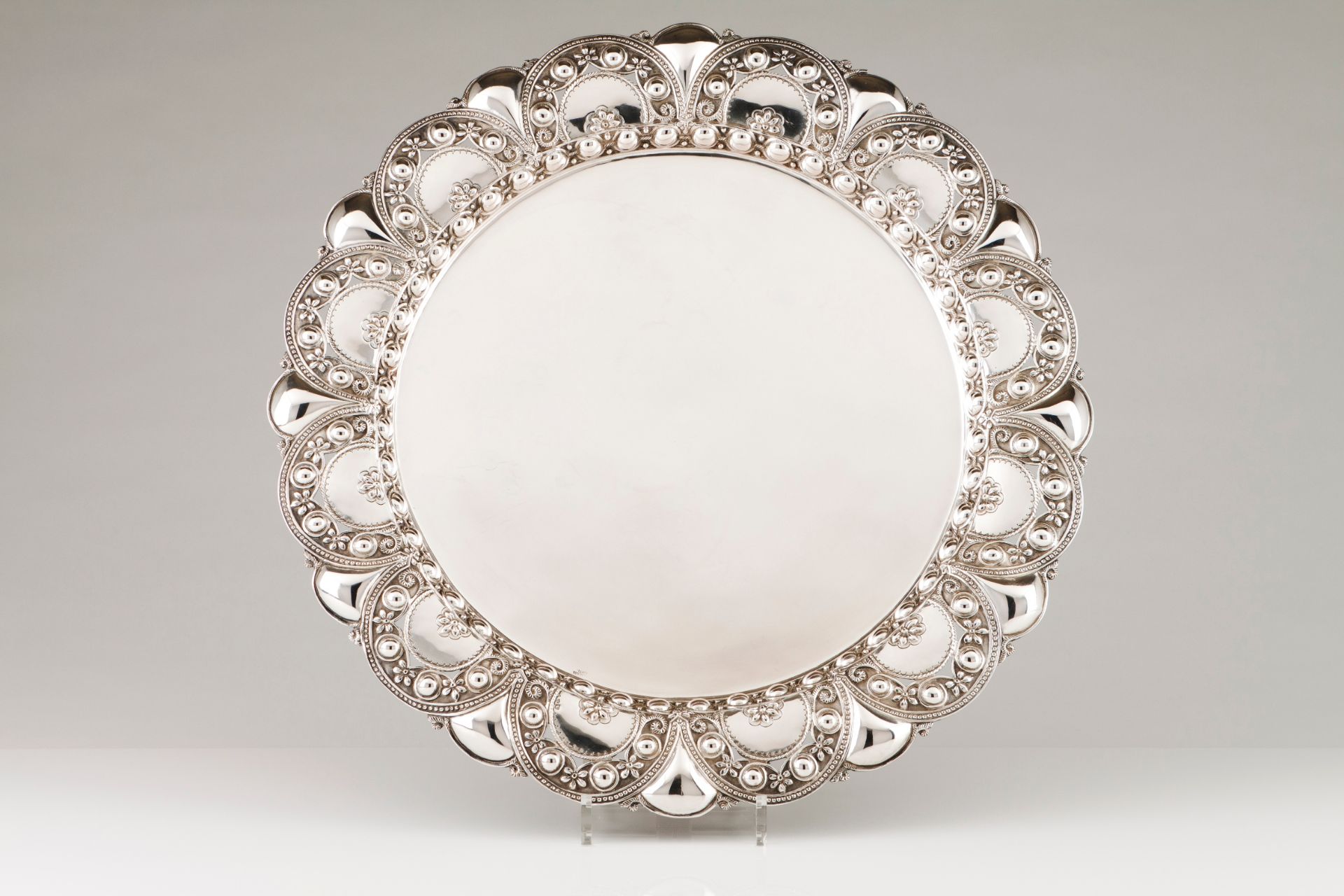 A large salverPortuguese silver Plain centre and lip of unusual scalloped and raised decoration