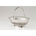 A bread basketPortuguese silver, 19th century Plain centre, geometric motifs pierced oval shaped