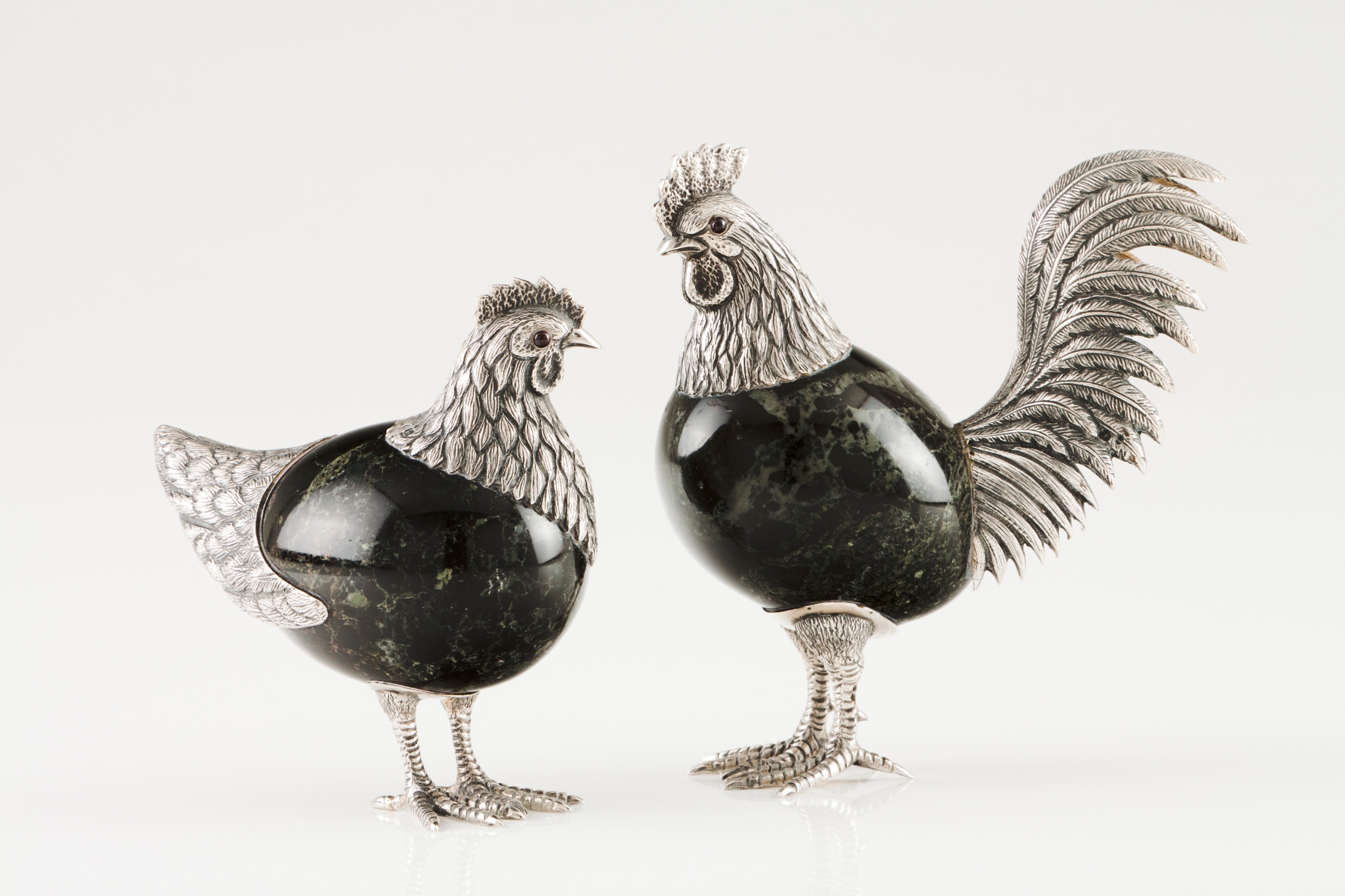 A cockerel and henSilver and hardstone Moulded, engraved and chiselled silver with applied glass